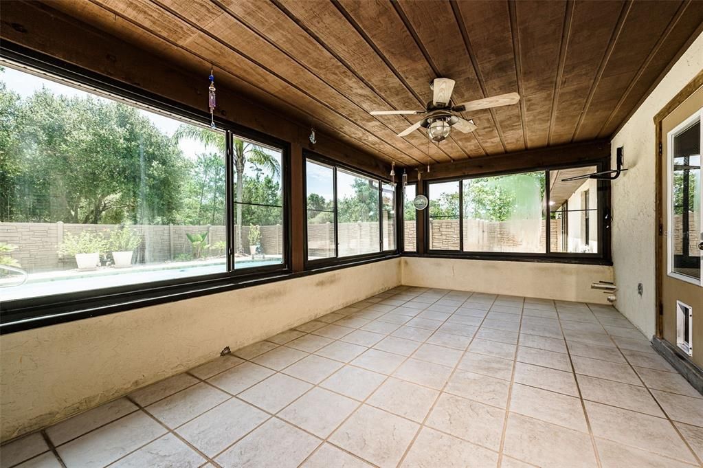 Florida room glass enclosed with windows that slide for screened in porch breezes. All tiled. 12x22