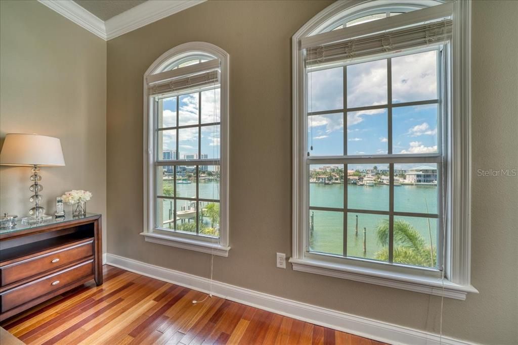 Large hurricane windows offer stunning views! Perfect coffee in bed way to start your day!