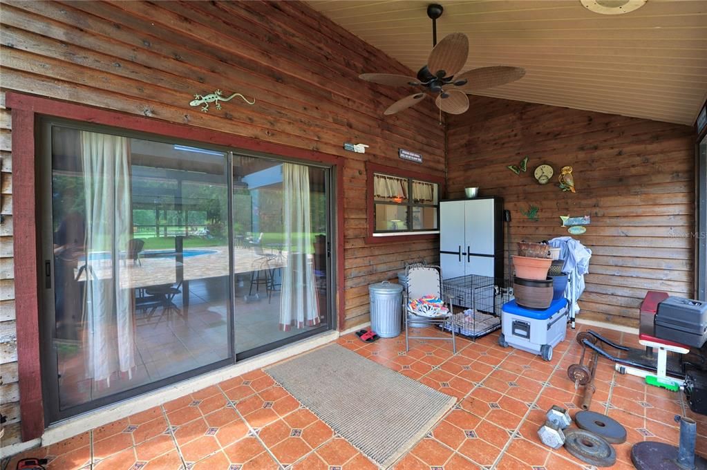 back screened porch with sliders to kitchen
