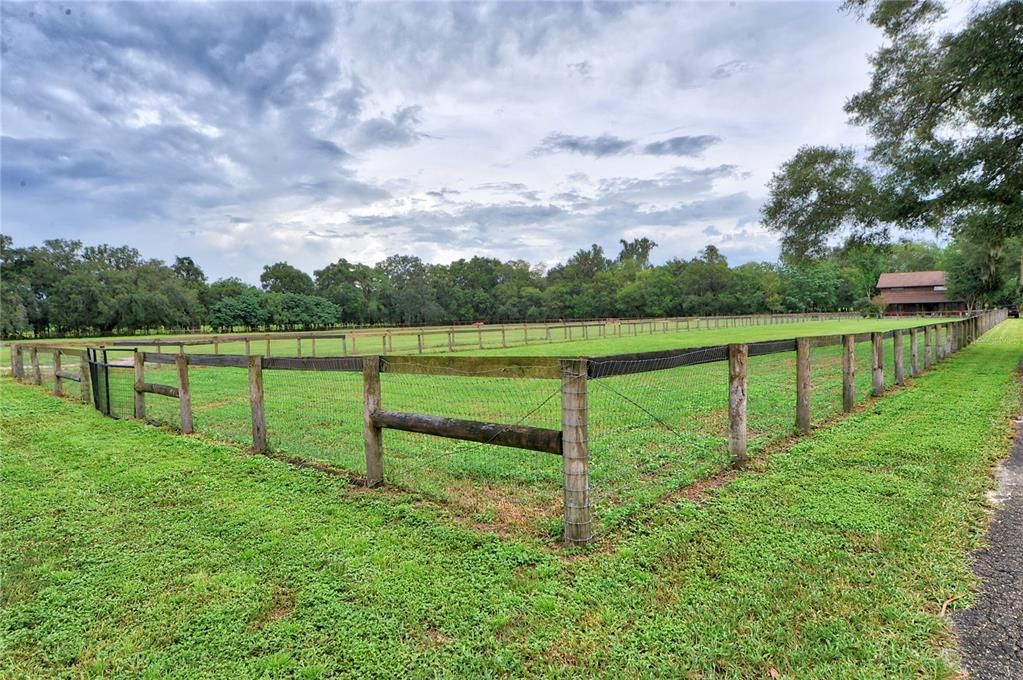 another paddock view by barn viewing the home