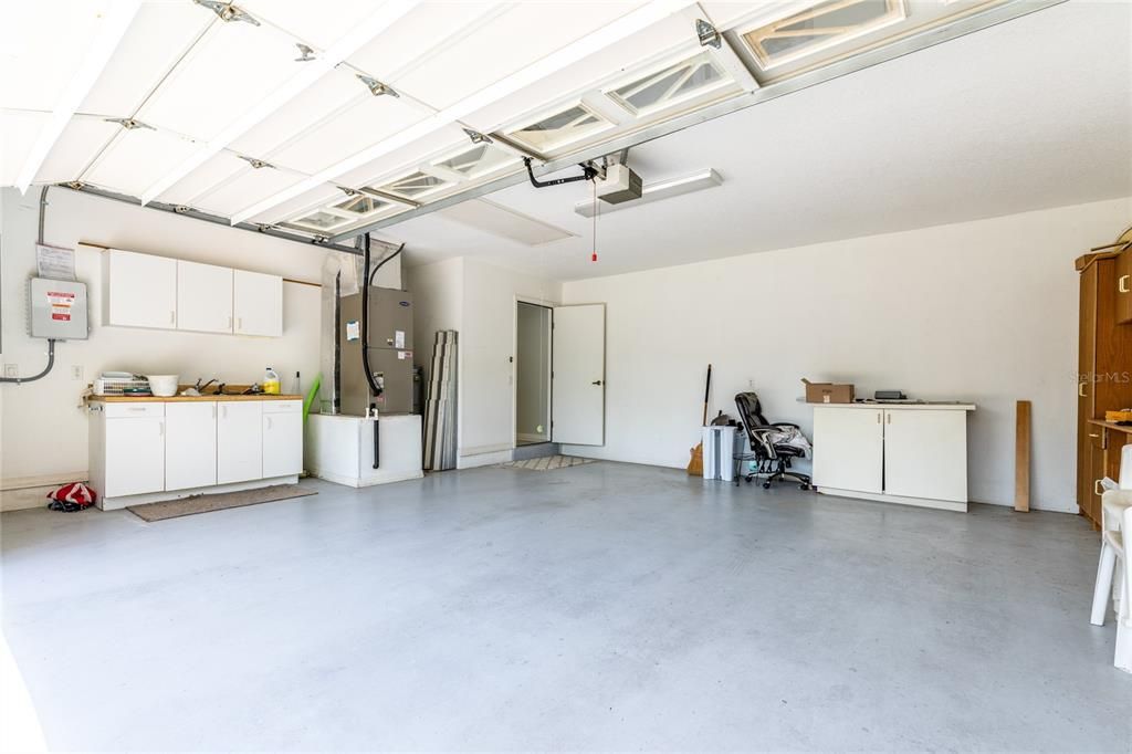 Garage has sink & cabinets for work space
