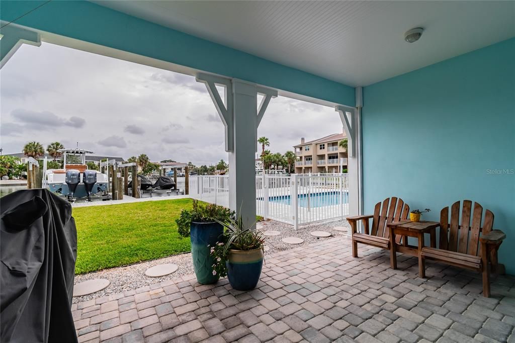 Large back patio area with easy access to pool and intracoastal.
