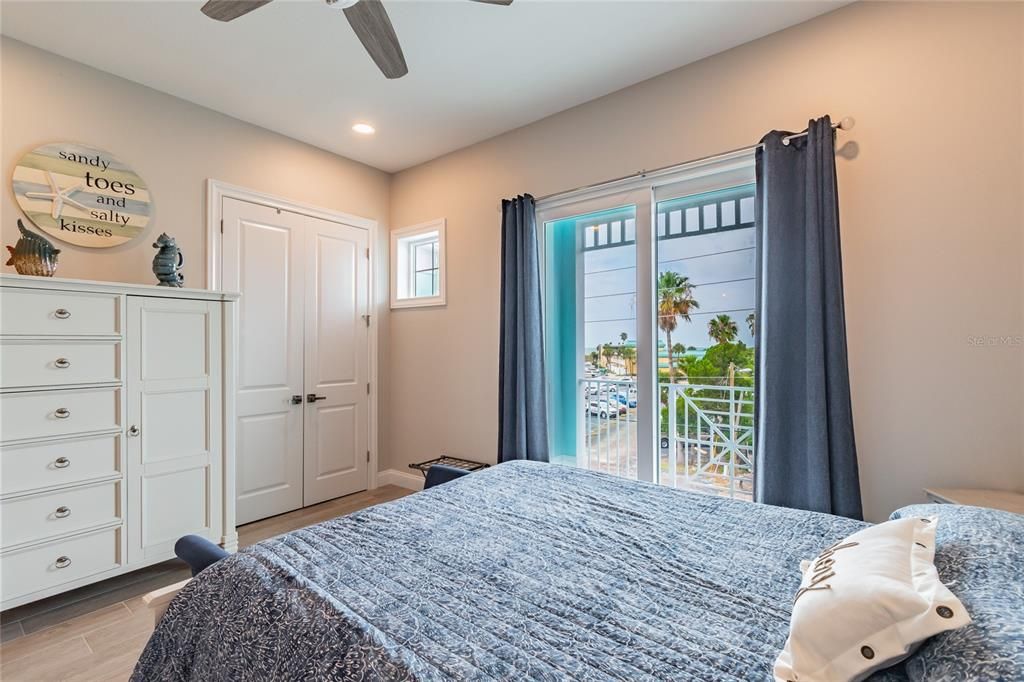 3rd fl bedroom with sunset views and views of the gulf.