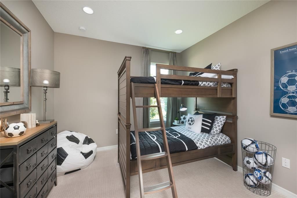 REPRESENTATIVE PHOTO. This fun secondary bedroom has a cozy and relaxing vibe.