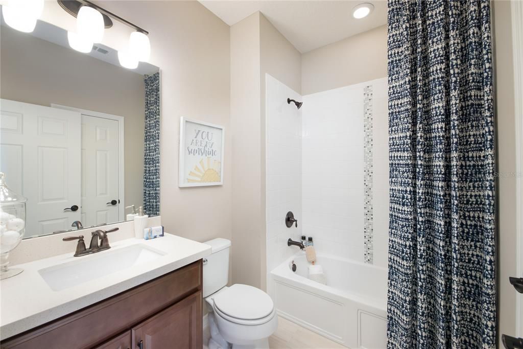 REPRESENTATIVE PHOTO. Another cute secondary bathroom is a convenient touch just off the bedrooms.