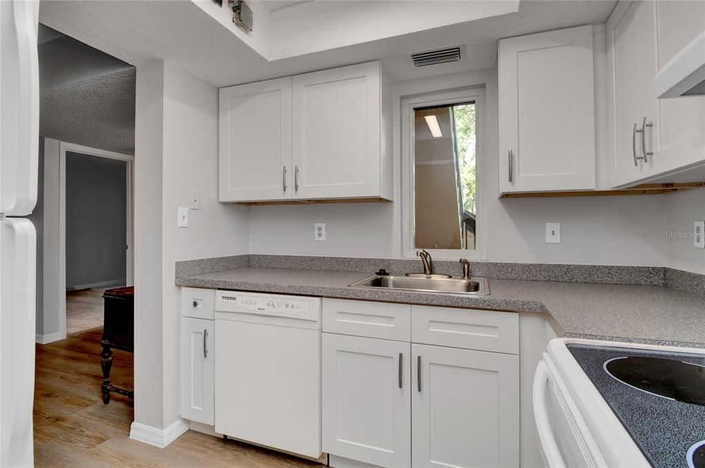 Kitchen has fridge, dishwasher and stove for your convivence.