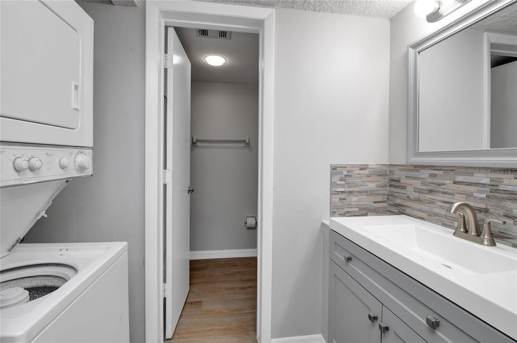 Master bathroom has new vanity, backsplash, paint, and toilet. Washer and dryer are located in master bathroom.