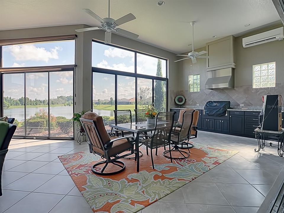SPECTACULAR GLASS ENCLOSED LANAI WITH DIAGONAL TILE FLOORING! WHAT A GREAT VIEW!!
