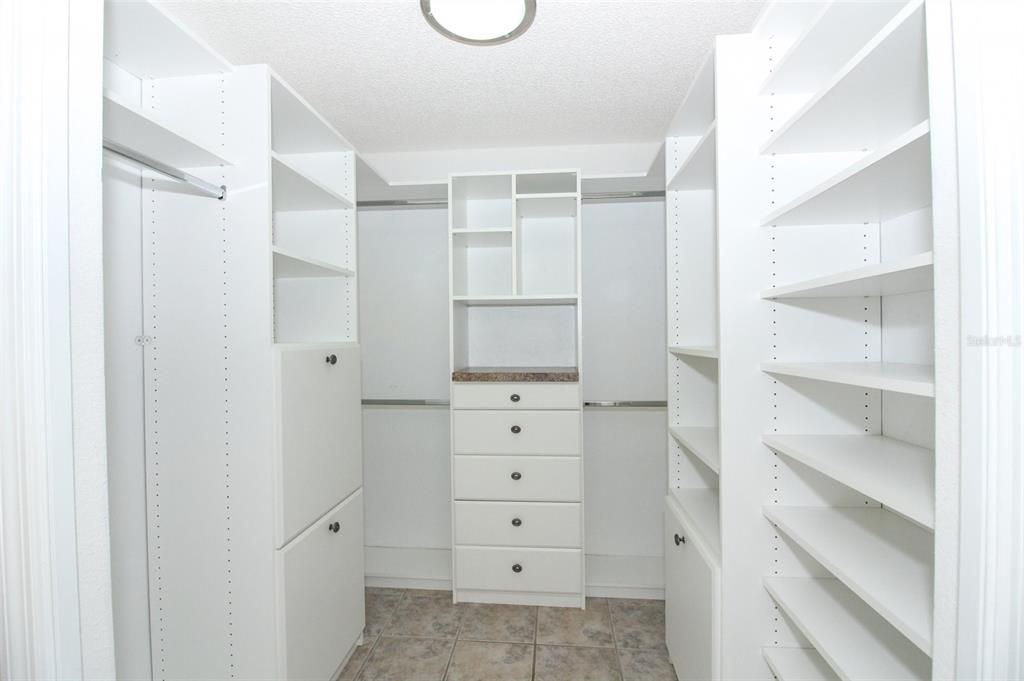 Master Walk In Closet with Built In Shelves