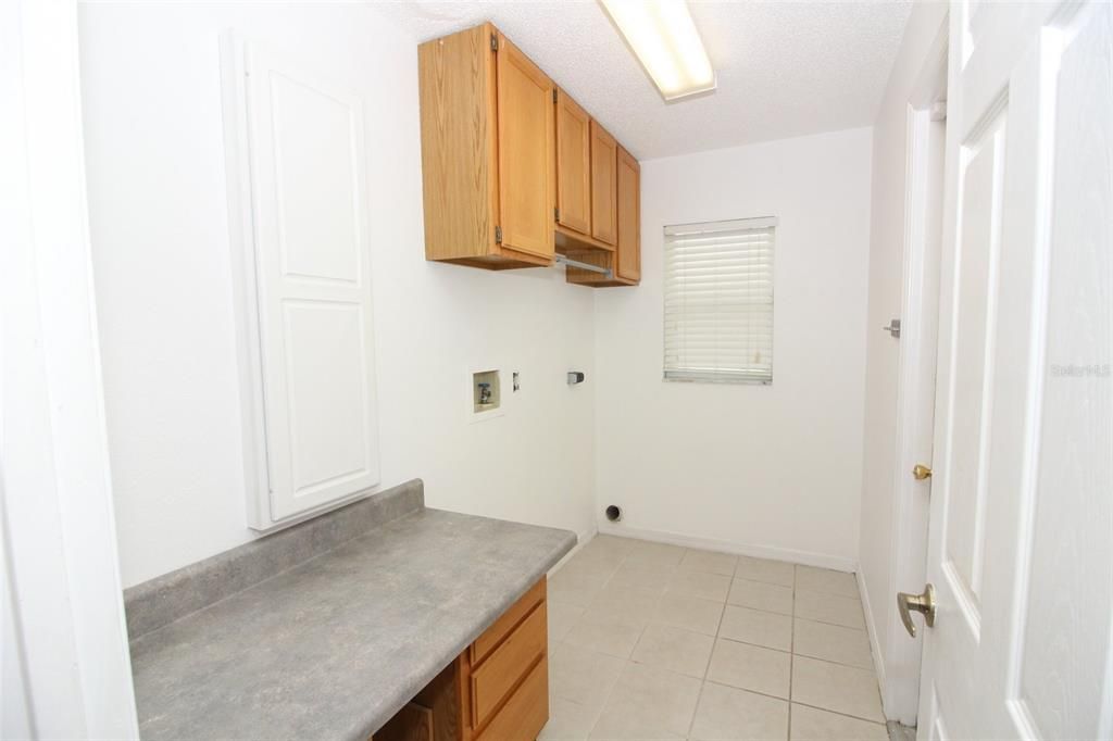 Inside Laundry Room with Built in Cabinets