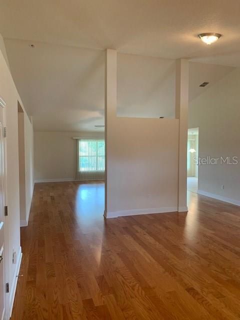 Interior view of home from front door walking in - soaring tall ceilings and plenty of room for a growing family