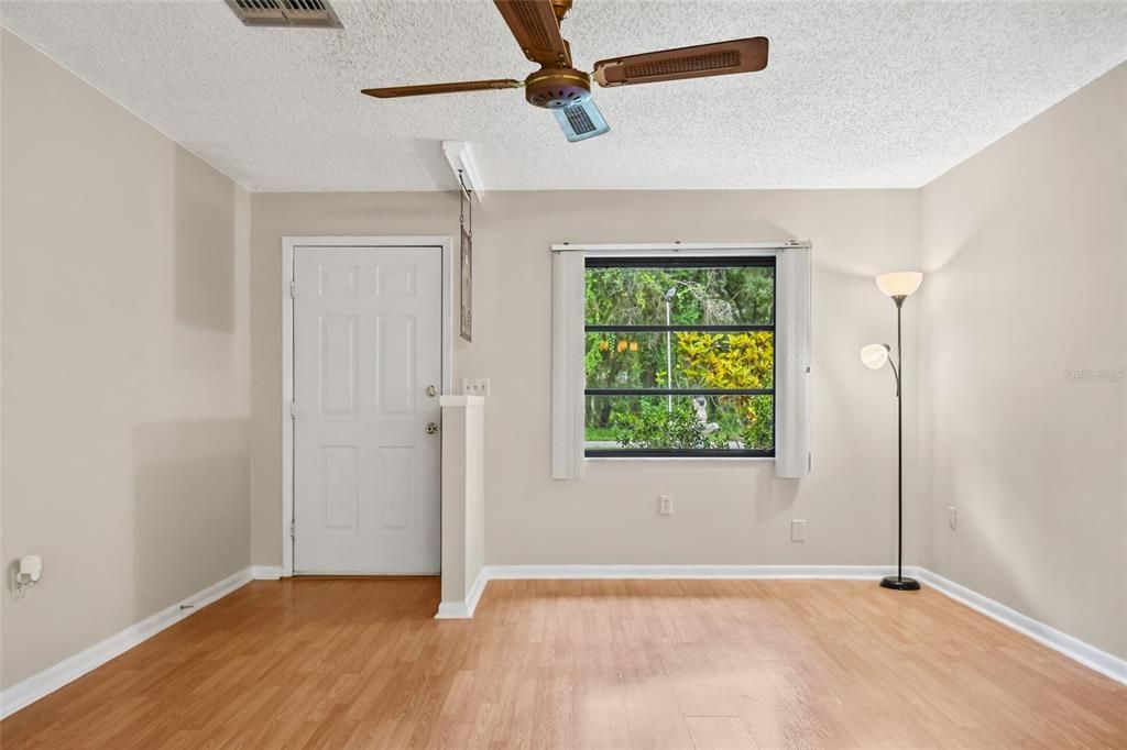 Great room upon entry with natural light window pictured needs replacement and is currently non operational.