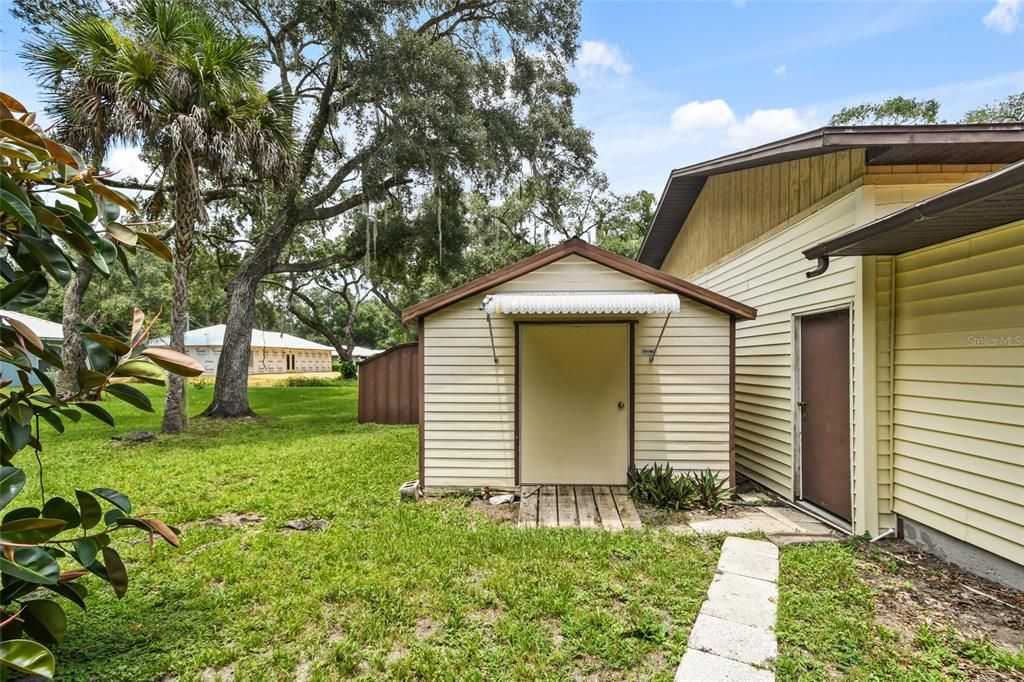 Through the brown door you are immediately greeted by the first of two metal roofed sheds.