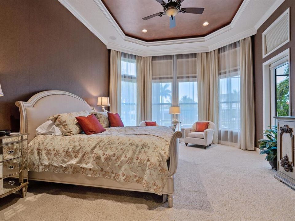 First floor master suite with views of the canal beyond.