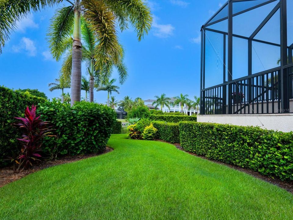 Lush landscaping for privacy surrounds the home.