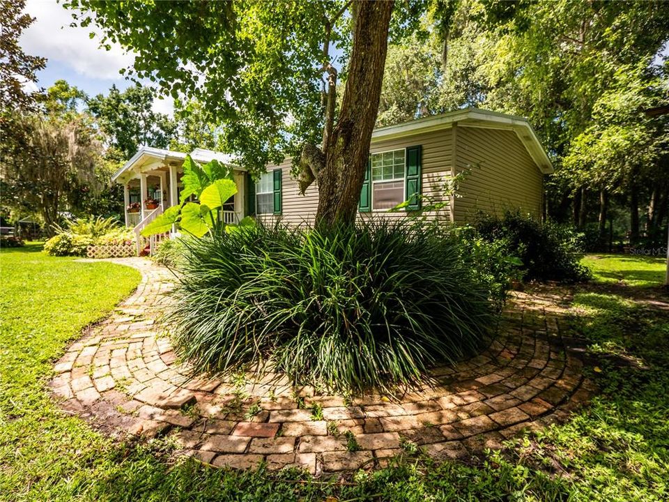 Mature Landscaping and brick wrap around sidewalk