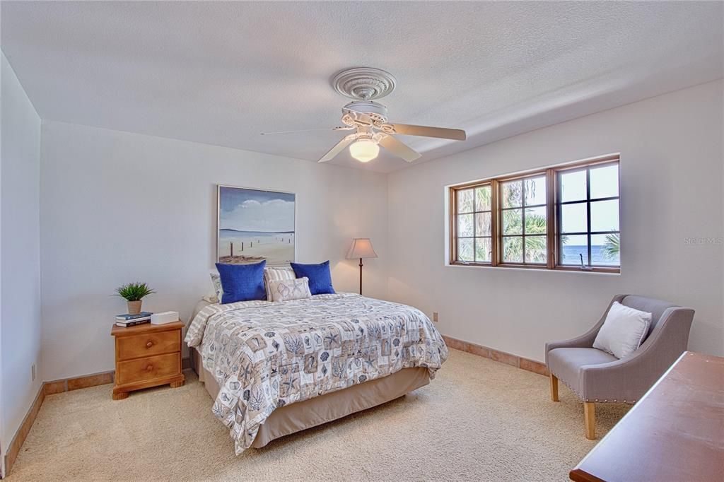 The top floor boasts 2 master suites, each with walk-in closets. This 2nd Suite even has views of the Gulf of Mexico!