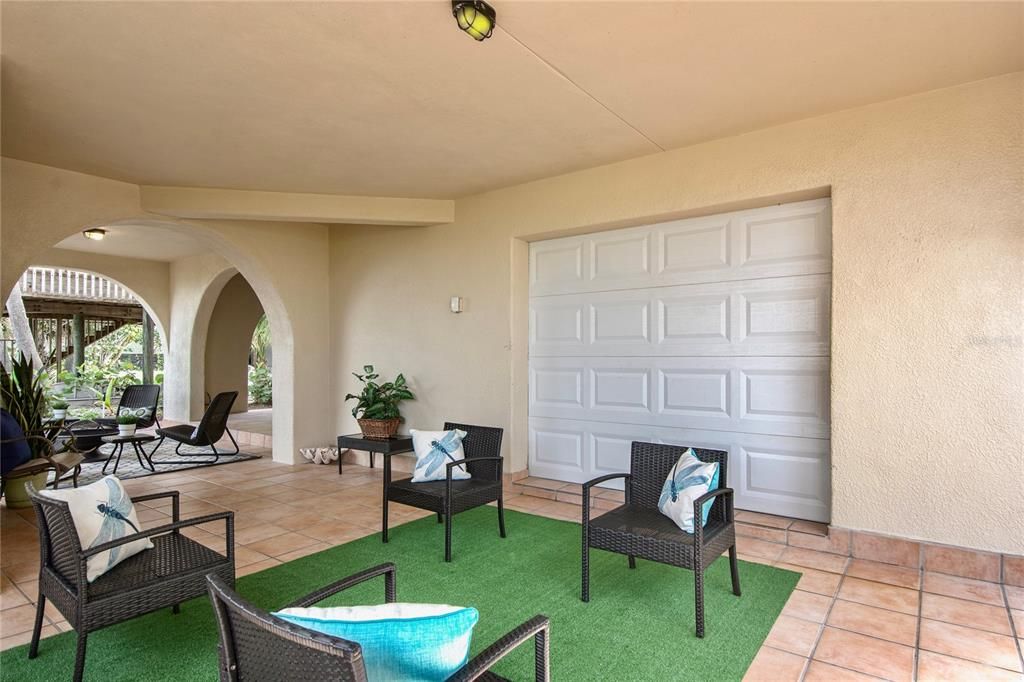 For convenience, a full size garage door leads from garage and workshop to one of the many ground floor terraces.
