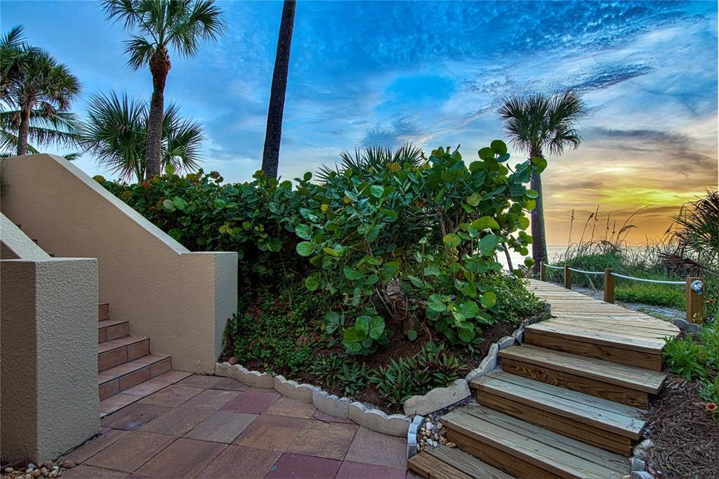 Lush with tropical landscaping, your back yard beach is accessed by your own private wooden walkway.