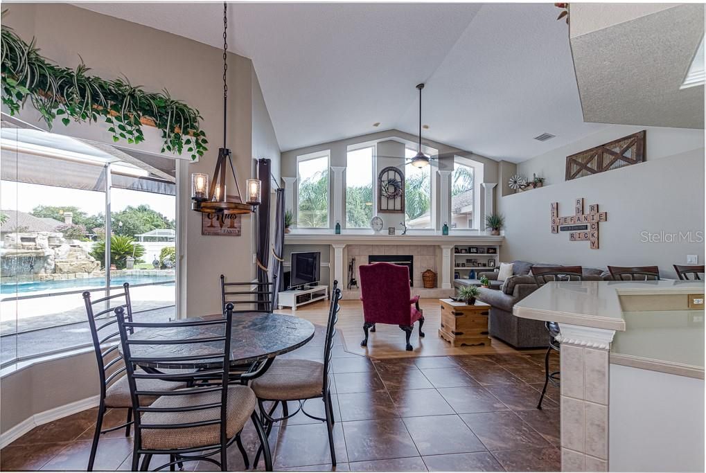 Breakfast nook and Family Room...Don't miss the pool view!
