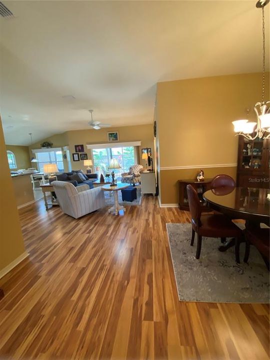 Large dining area with beautiful laminate flooring.  Lots of room for large table if desired.