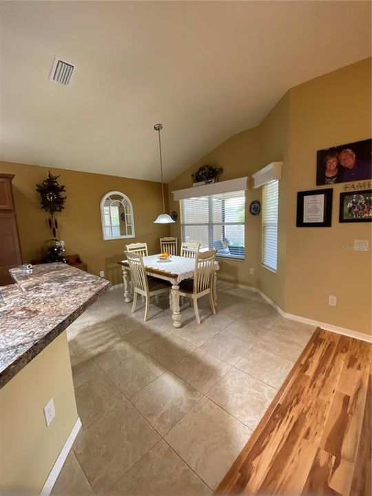 Dining nook off kitchen with great windows and view of patio area.