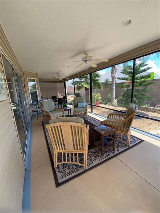 Large screened lanai with terrific  view of gardens and villa wall behind for privacy.
