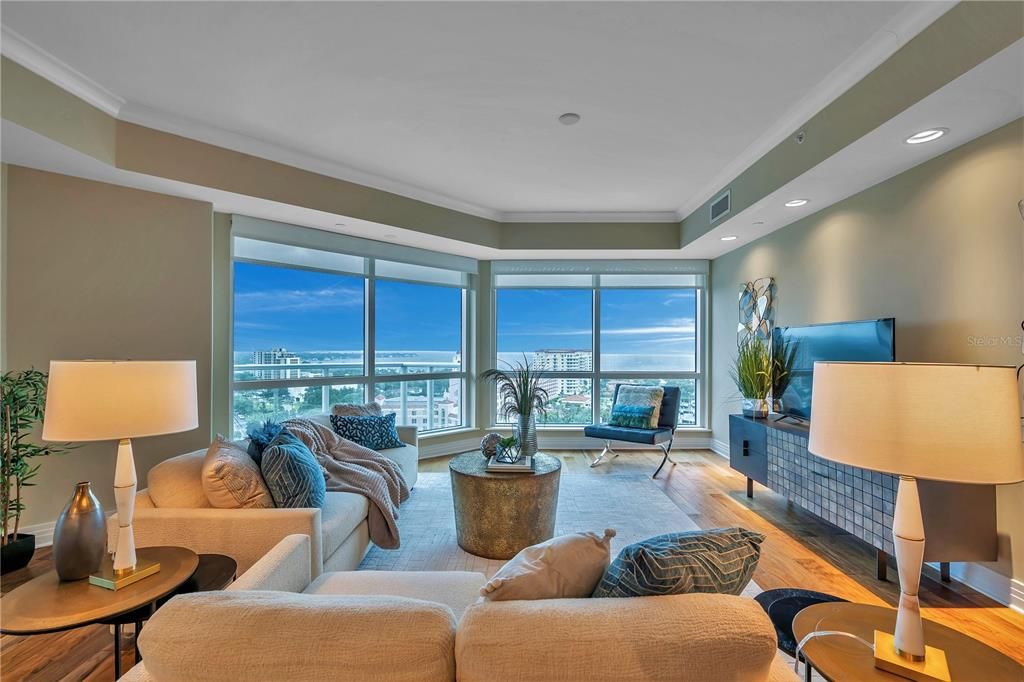 Living room has floor to ceiling windows for the spectacular view!