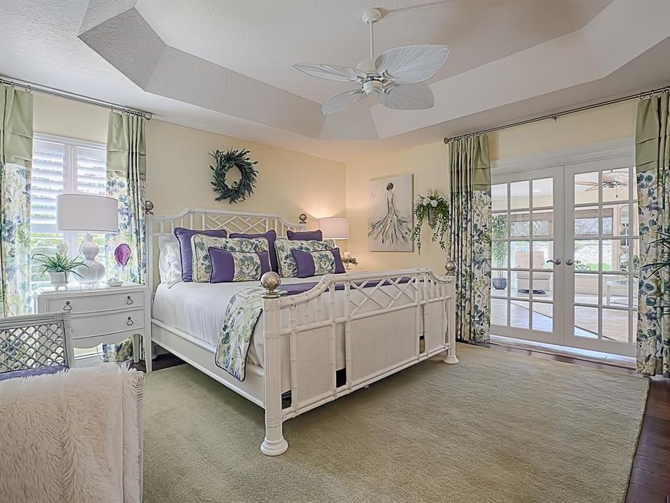 BEAUTIFUL MASTER BEDROOM WITH HARDWOOD FLOORING, TRAY CEILING AND FRENCH DOORS THAT OPEN OUT TO THE HUGE BONUS ROOM!