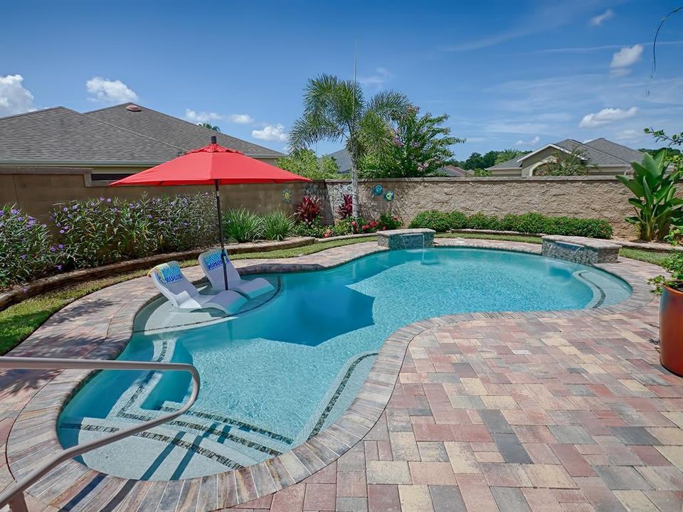 PAVERS AROUND THE ENTIRE POOL AREA AND PATIOS EVERYWHERE!