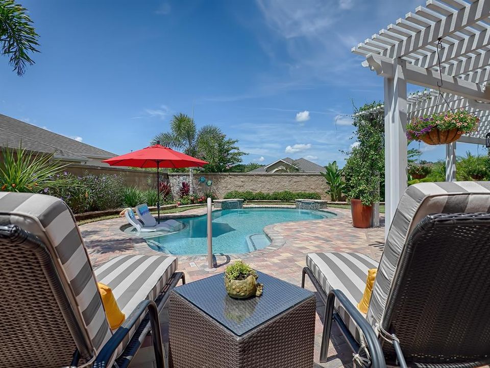 AMAZING NEW 27X15 POOL WITH WATERFALLS AND A "COOLING" SHELF AND COMFY "LEDGE LOUNGERS"!