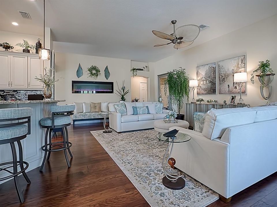 LOVELY LIVING ROOM WITH CUSTOM FAN AND BUILT-IN ELECTRIC FIREPLACE!