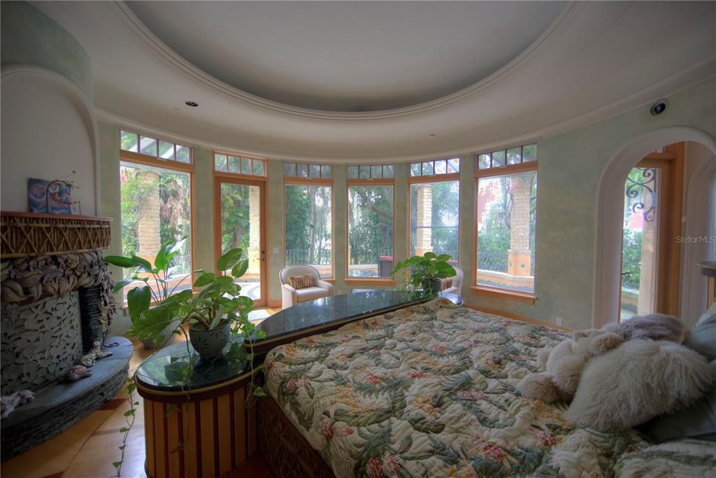 Main bedroom with firplace to the left also featuring hand carvings.