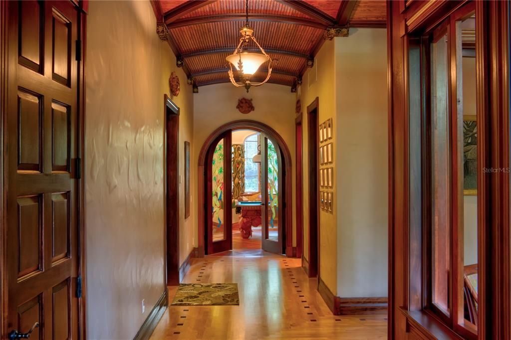 South hallway with custom wood flooring.