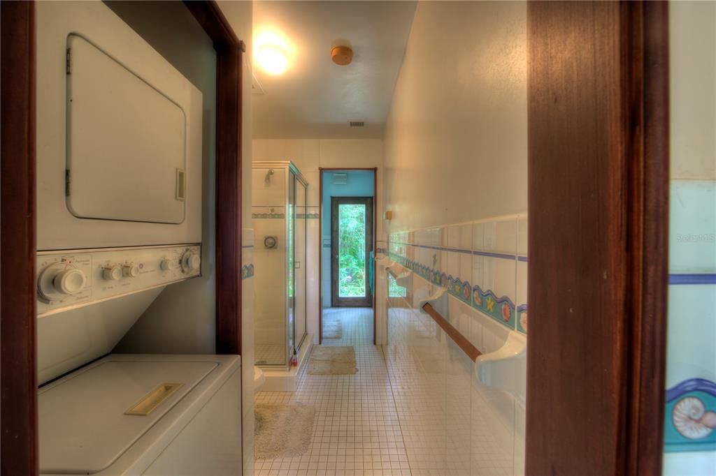 Bath and laundry in pool house.