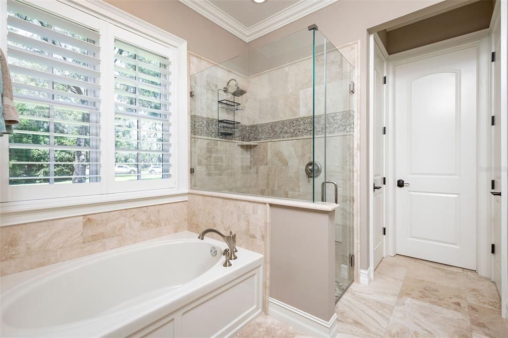 Soaking tub and the entrance to a Spacious 11 x 7 walk-in closet for the in-law suite