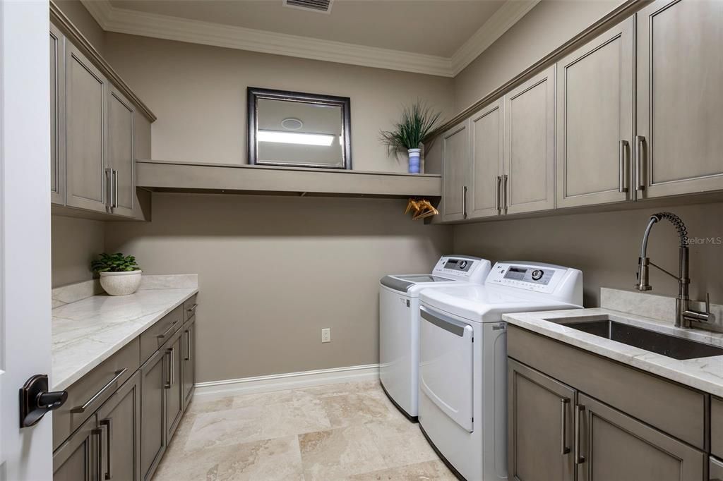 Laundry room with storage, with drying rack and laundry chute from second floor
