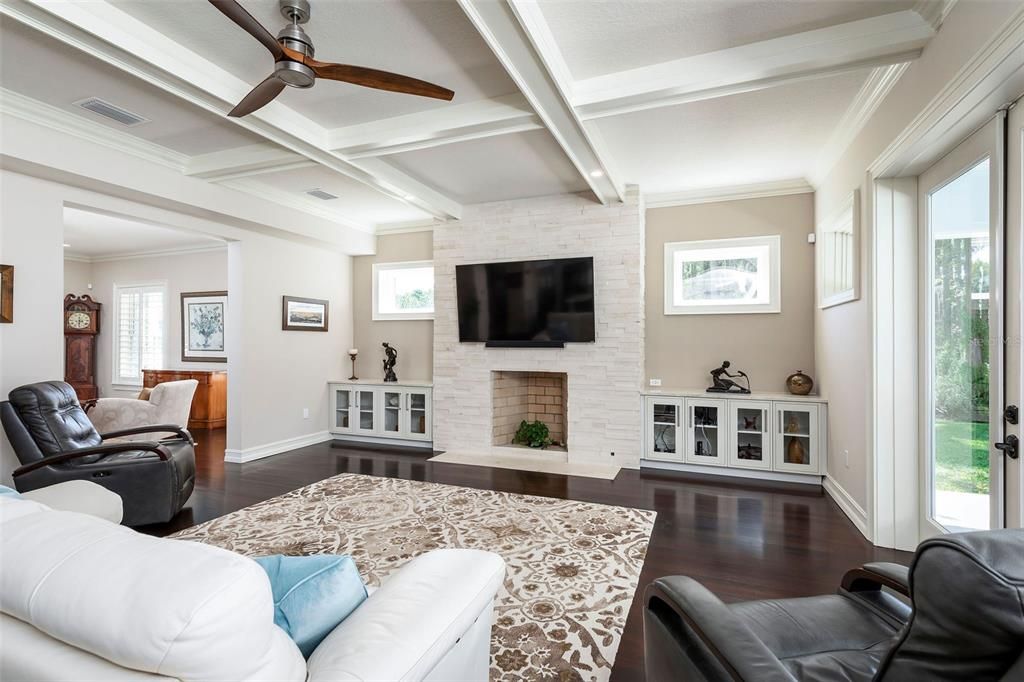 Family room with fireplace and lovely coved ceiling detail.