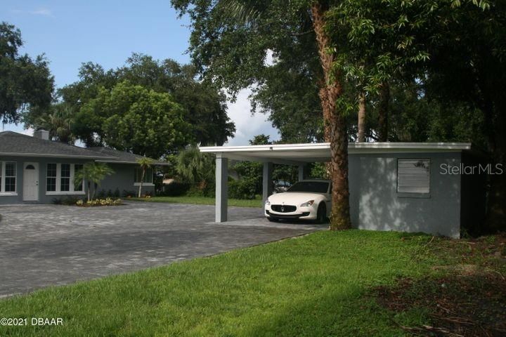 Detached carport with covered garage and storing