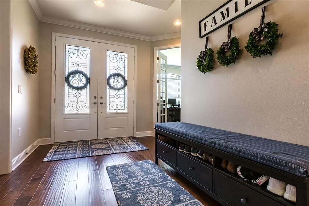 Featuring a couple door entry, hand scraped wood floors throughout the majority of the home