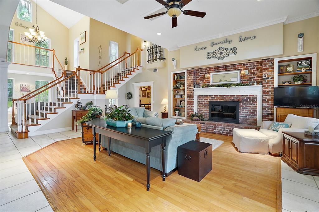 Living Room with Wood Floors and Brick Fireplace
