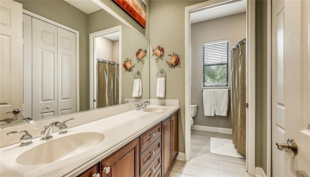 Bathroom with double sink and pocket door for privacy