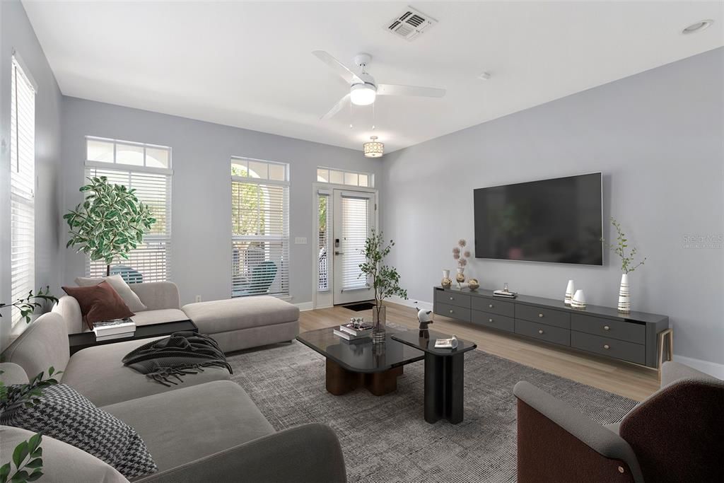 The living room has fresh lighting from full size windows, and front door. Virtually Staged