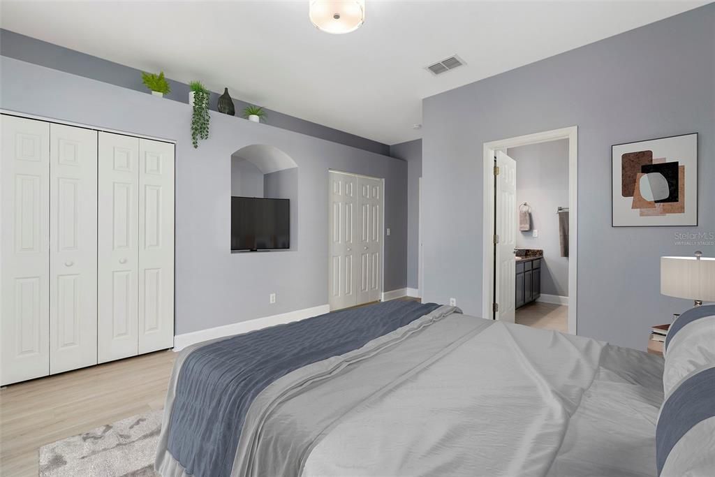 The Master Bedroom offers two spacious closets a nook for the tv, a decorative shelf and the ensuite bath. Virtually Staged