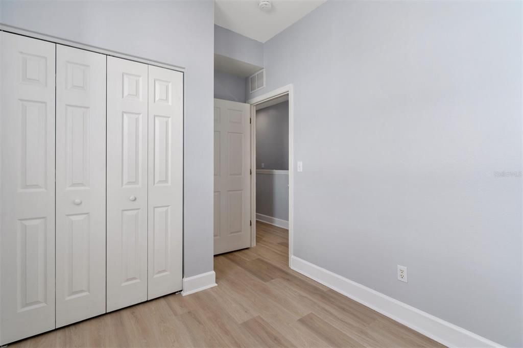 Third Bedroom door to hall and closet. A smaller room would that could also be a great reading room, office, game or craft room, you decide!