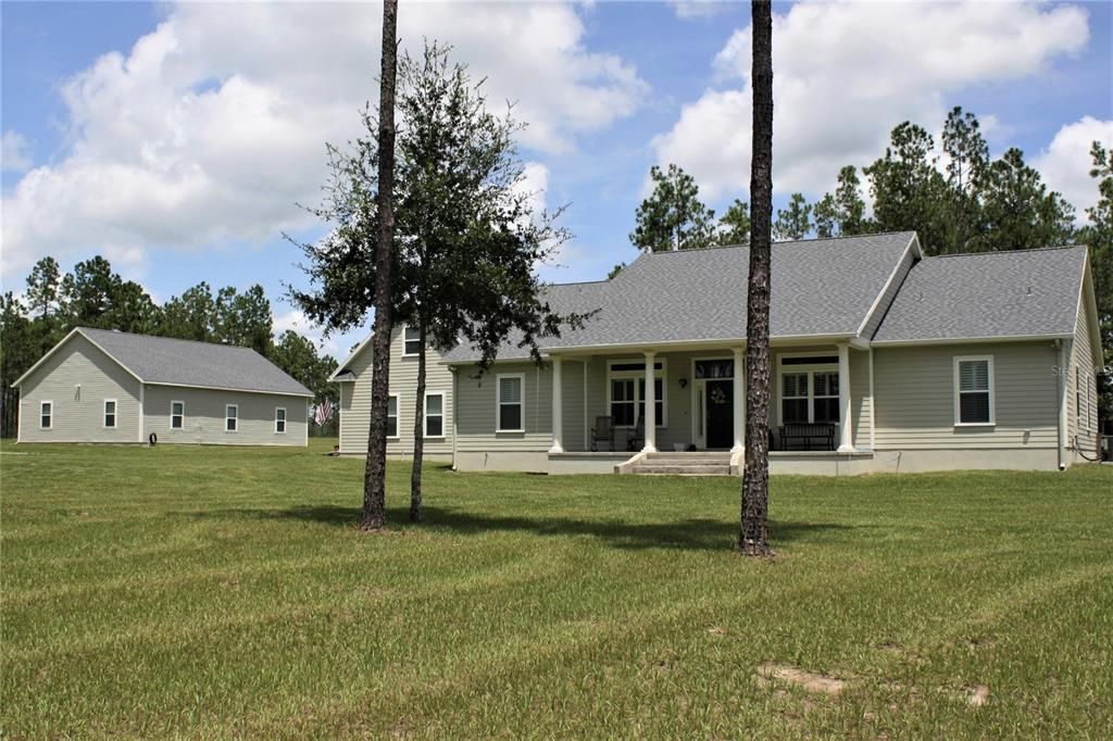 Front of home showing large workshop/barn