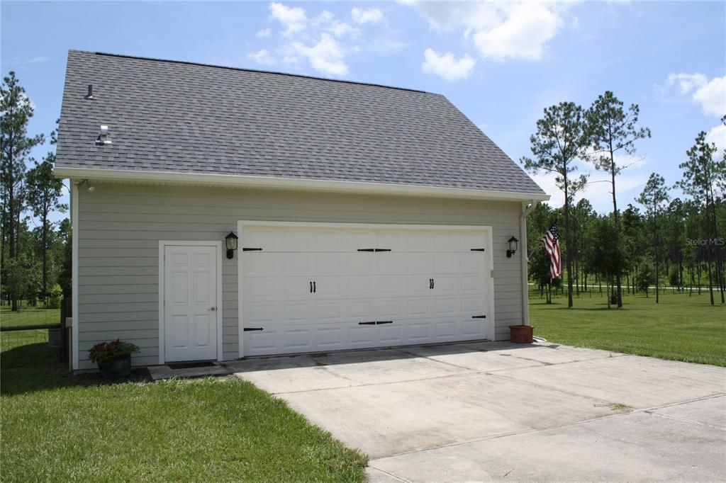 Oversized attached two car garage with side entry