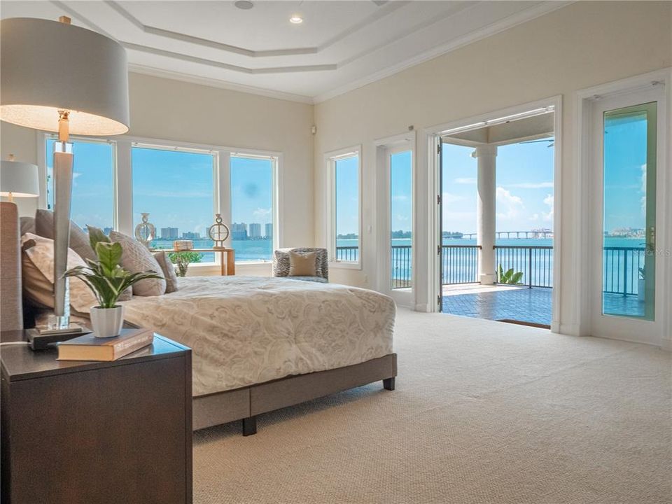 Luxurious primary suite with unbelievable water views