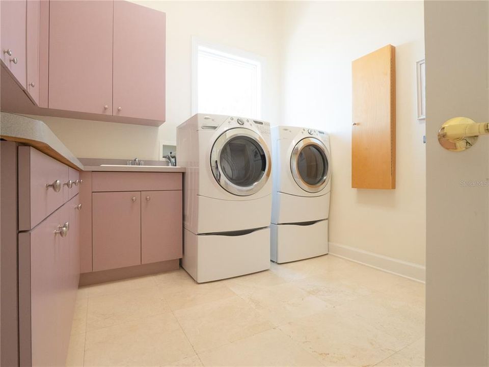 Large laundry facility with shower and plenty of storage