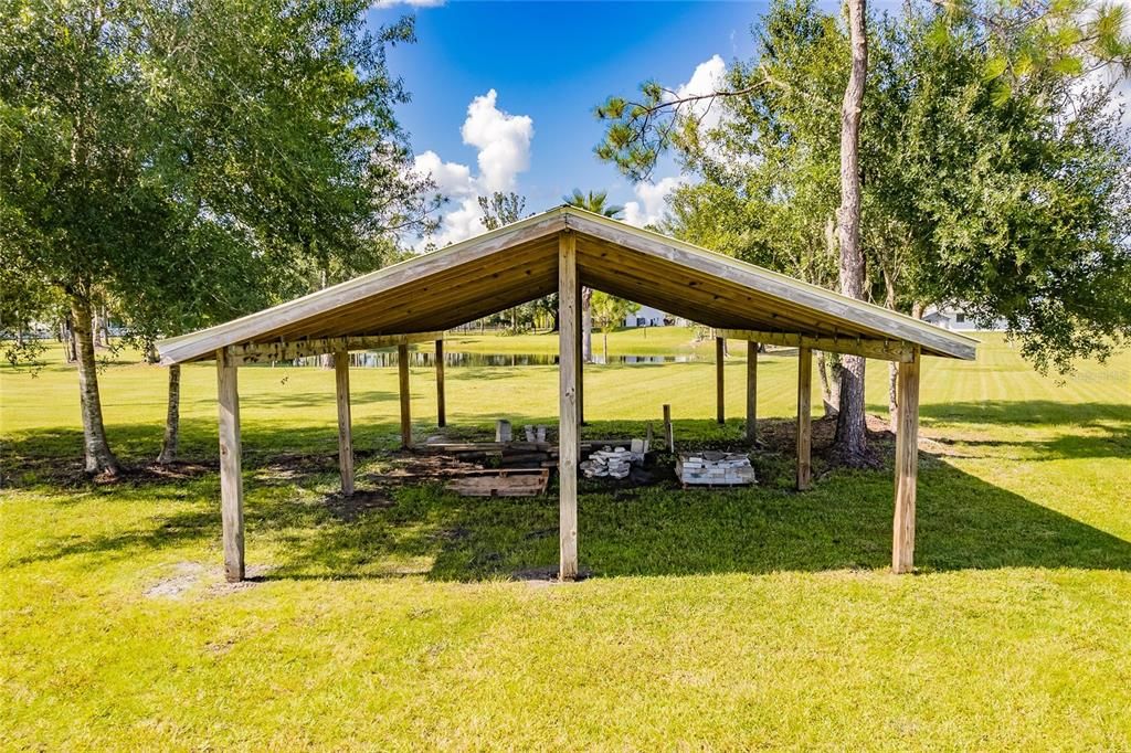 COVERED SHELTER IN THE REAR PASTURE.